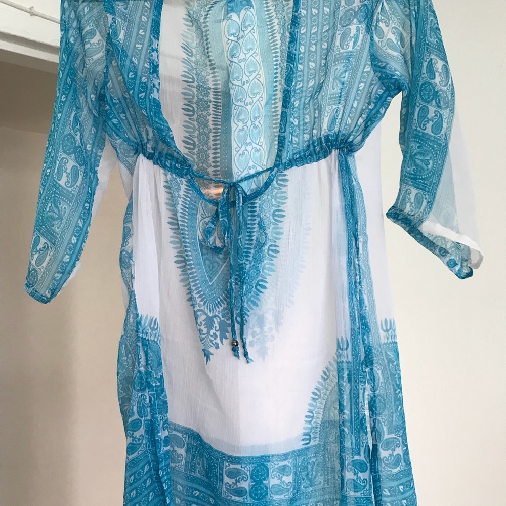 A blue and white cover-up to take to the beach